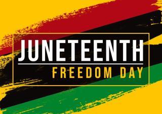 Sign saying "Juneteenth: Freedom Day"