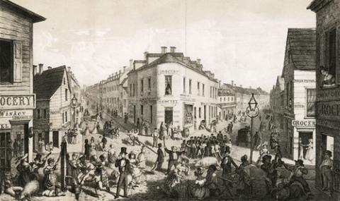 Black and white photo of New York City with people in the streets during the Irish Famine.