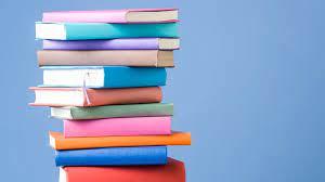 Pile of books with a blue background.