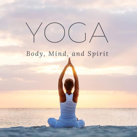 The words Yoga, Body, Mind & Spirit with the ocean and sky in the background.