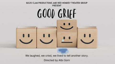 Wooden blocks with smiley faces on them with a gray background.