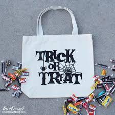 white tote bag with trick or treat in black letters