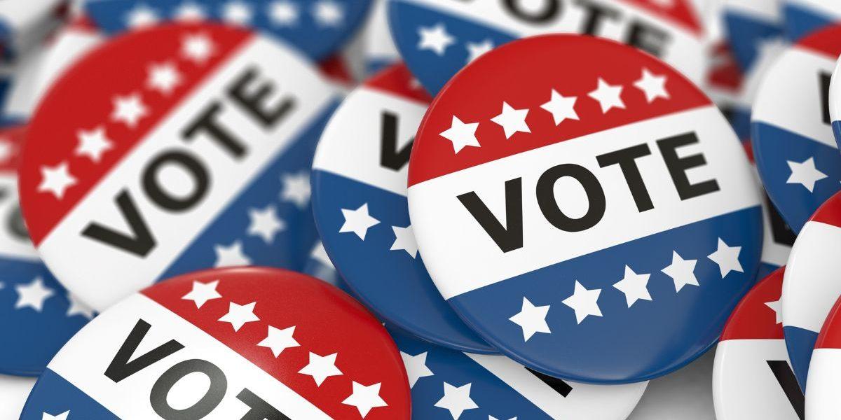 Red, white and blue vote pins.