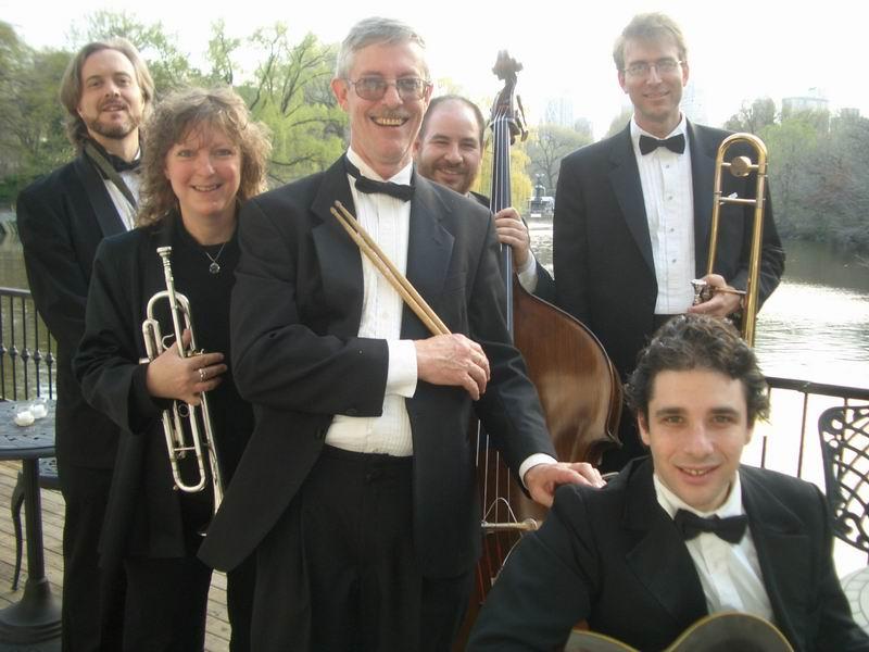 Men and women wearing black with trees and white background.
