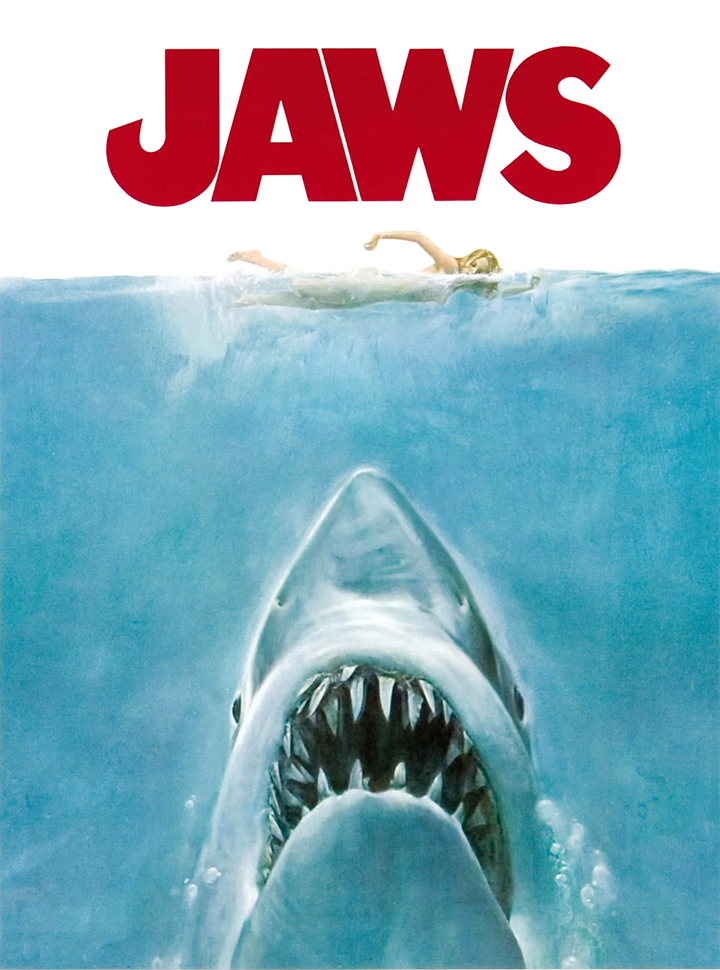 Shark in blue water and Jaws in red letters.